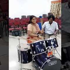 Girl playing drums rolls