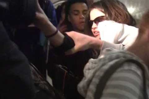 Selena Gomez Pushes Away Photographer At LAX