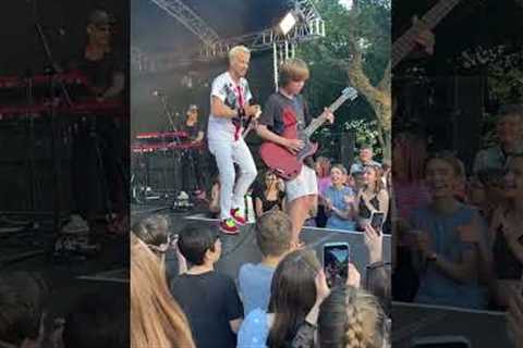 Can't believe this happened! 🤯 10 year old asks band at festival to let him play guitar..