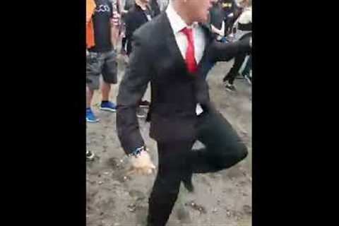 Guy looks out of place wearing a suit to a festival, until the beat drops | CONTENTbible
