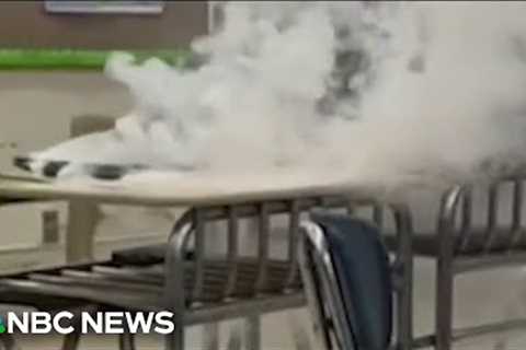 Viral TikTok trend appears to show students attempting to set laptops on fire