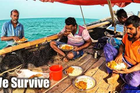 We survive cook and eating crabs, pulled the nets from the sea into the boat and caught fish