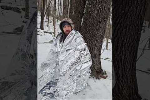 Pocket sized heated survival shelter