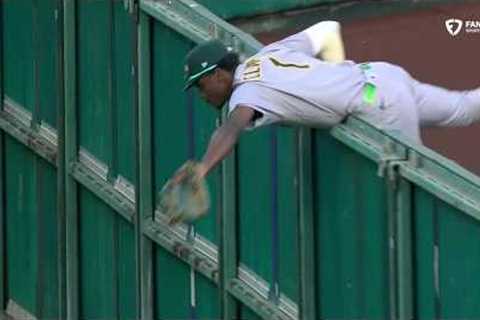 CATCH OF THE YEAR⁉️ Denzel Clarke CLIMBS THE WALL for the HOME RUN ROBBERY 🤯 | ESPN MLB