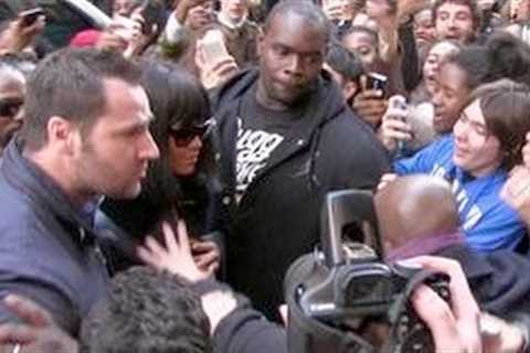 REALLY CRAZY - RIHANNA almost crushed by a sea of fans while entering her hotel in Paris !!!