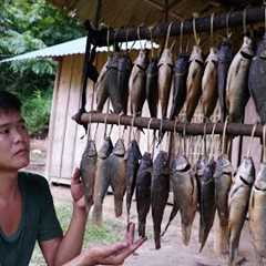 survival in the wild, hunting fish in streams after rainy days, preserving fish by smoking