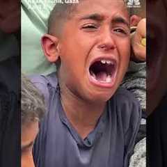 Hungry children struggle for food handouts in Gaza