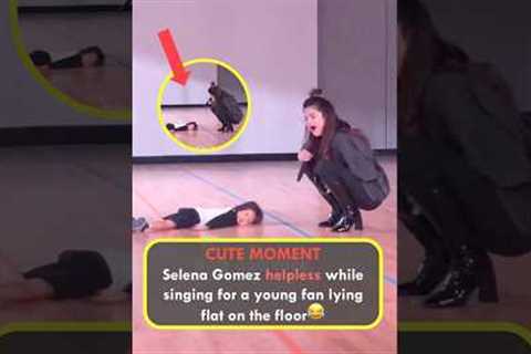 CUTE MOMENT: Selena Gomez helpless while singing for a young fan lying flat on the floor