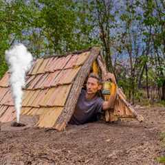 Building a cozy survival shelter. Warm stove, wooden shingles.Bushcraft,Survival Skills.