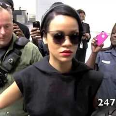 Rihanna arriving through JFK Airport was all Smiles rocking her new hair cut in NEW YORK CITY