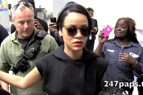 Rihanna arriving through JFK Airport was all Smiles rocking her new hair cut in NEW YORK CITY