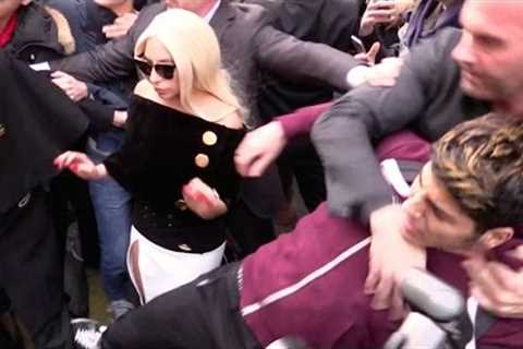 CRAZY FANS ! Lady Gaga hard hotel exit as BODYGUARD FIGHTS a fan in Paris