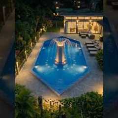 Building a modern resort pool with fountain.