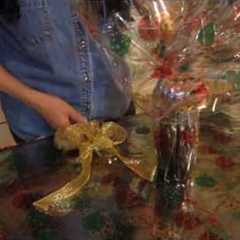 Wrapping a bottle in cellophane