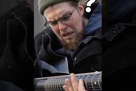 Street musician can’t believe the guitar I just handed him
